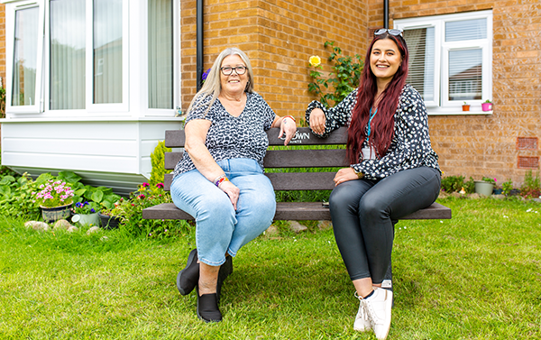 Two colleagues sat on a bench